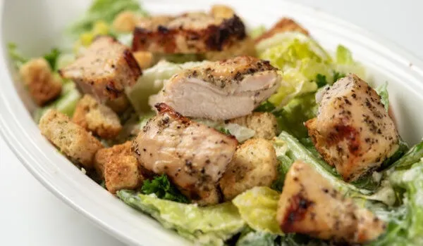Caesar salad with grilled chicken and croutons